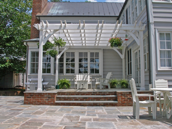 Here are a few more photos of this pergola and patio design .