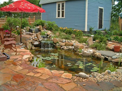 Ponds at patios can be bordered with boulders.