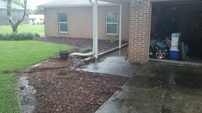 water draining towards house