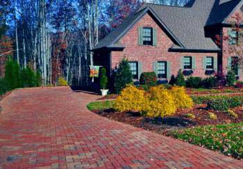 A multi-colored brick driveway.