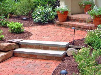 Brick walk with bluestone treads.