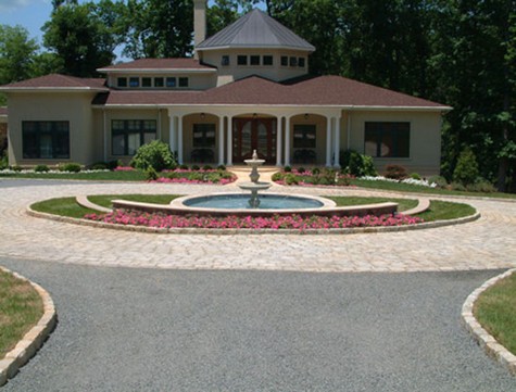 tar and chip leads to a granite driveway courtyard