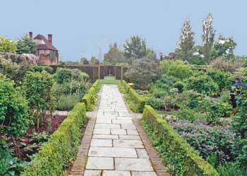 English garden design has straight lines and loose flowers.