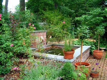 Formal water feature with lion's head fountain.