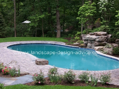Paver pool decking and waterfall.