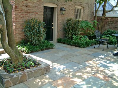 Patterned bluestone patio which is dry laid.